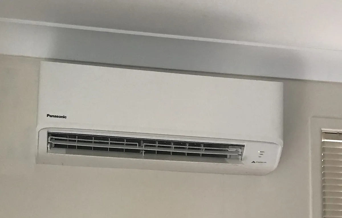 A new Panasonic split system head mounted high on a white wall